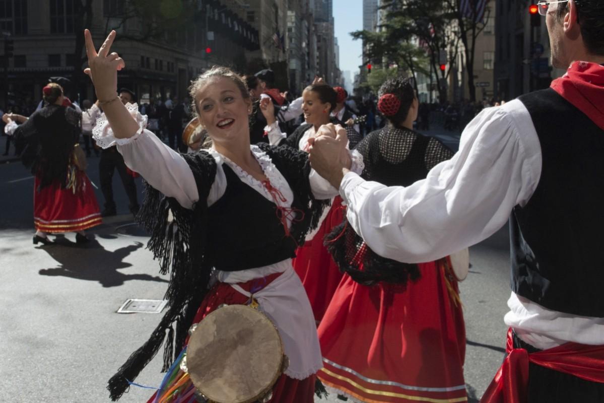 Dancers perform in traditional attire during the Columbus Day Parade on Fifth Avenue in the Manhattan borough of New York, October 12, 2015. Columbus Day Parade