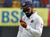 Virat Kohli India red cricket ball