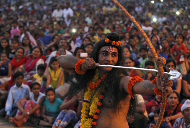 An artist dressed as Hindu God Rama acts in a religious play during Dussehra festival celebrations in Chandigarh, India, October 22, 2015. Effigies of the 10-headed Demon King Dussehra