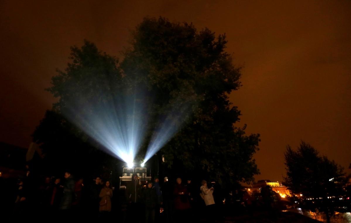 People watch the installation signal lights festival