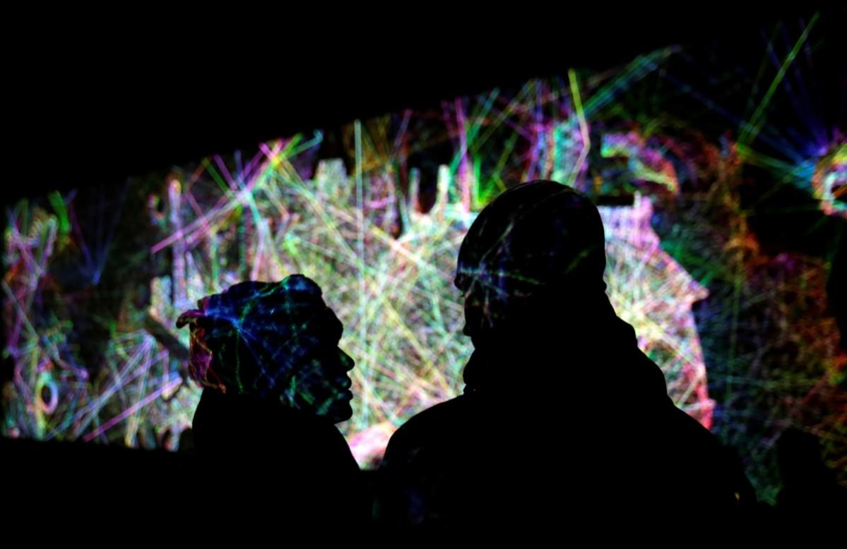 People stand in front of the installation signal lights festival