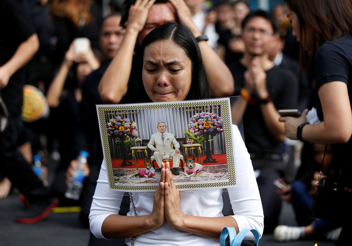 A woman cries as she offers condolences for Thailand's late King Bhumibol Adulyadej in front of the Grand Palace in Bangkok, Thailand October 15, 2016. thailand tourism indian travellers wedding season planners phuket bangkok king death passes away Bhumibol Adulyadej