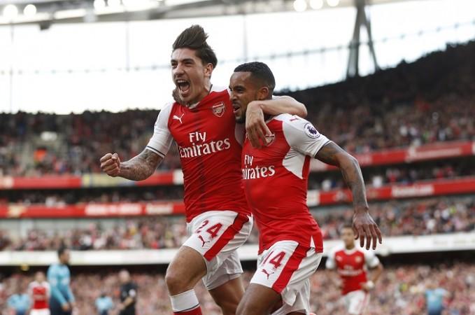 Arsenal forward Theo Walcott celebrates with teammate Hector Bellerin after scoring the opening goal against Swansea City in their Premier League game, October 15, 2016 Hector Bellerin Theo Walcott Arsenal