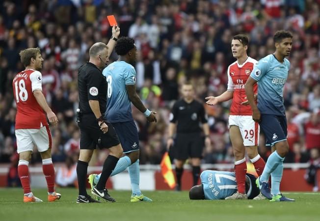 Granit Xhaka reacts as Jon Moss shows the Arsenal midfielder a straight red card in the Premier League match against Swansea Granit Xhaka Arsenal red card Jon Moss
