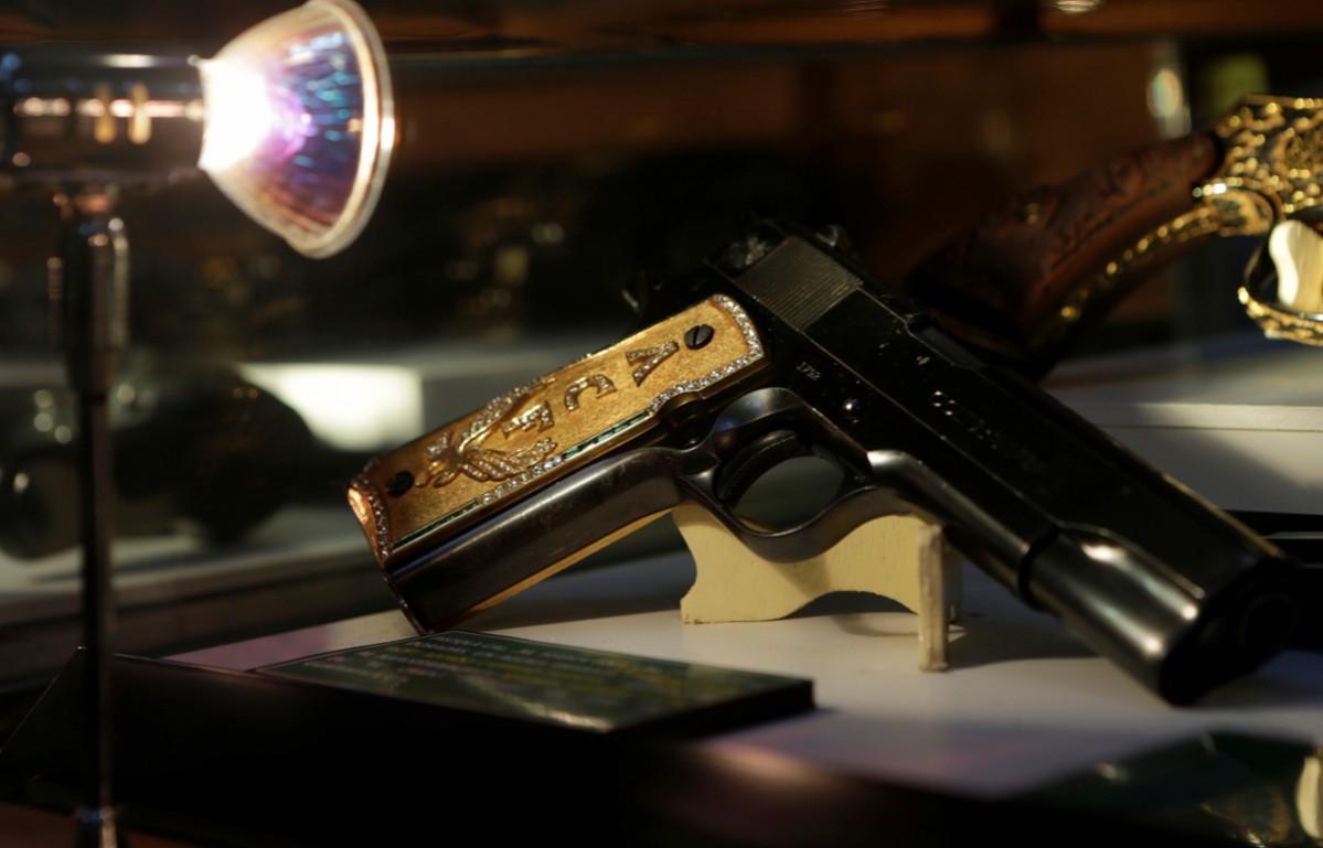 A gun decorated with gold and jewellery belonging to Mexican drug lord Amado Carrillo Fuentes is displayed in the Drugs Museum, used by the military to showcase to soldiers the lifestyles of Mexican drug lords, at the headquarters of the Ministry of Defense in Mexico City, October 14, 2016. Drugs Museum