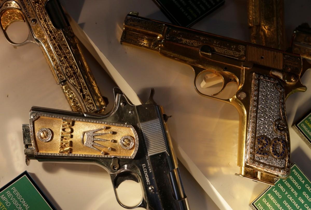 Guns decorated with gold and jewellery are displayed in the Drugs Museum, used by the military to showcase to soldiers the lifestyles of Mexican drug lords, at the headquarters of the Ministry of Defense in Mexico City, October 14, 2016. Drugs Museum