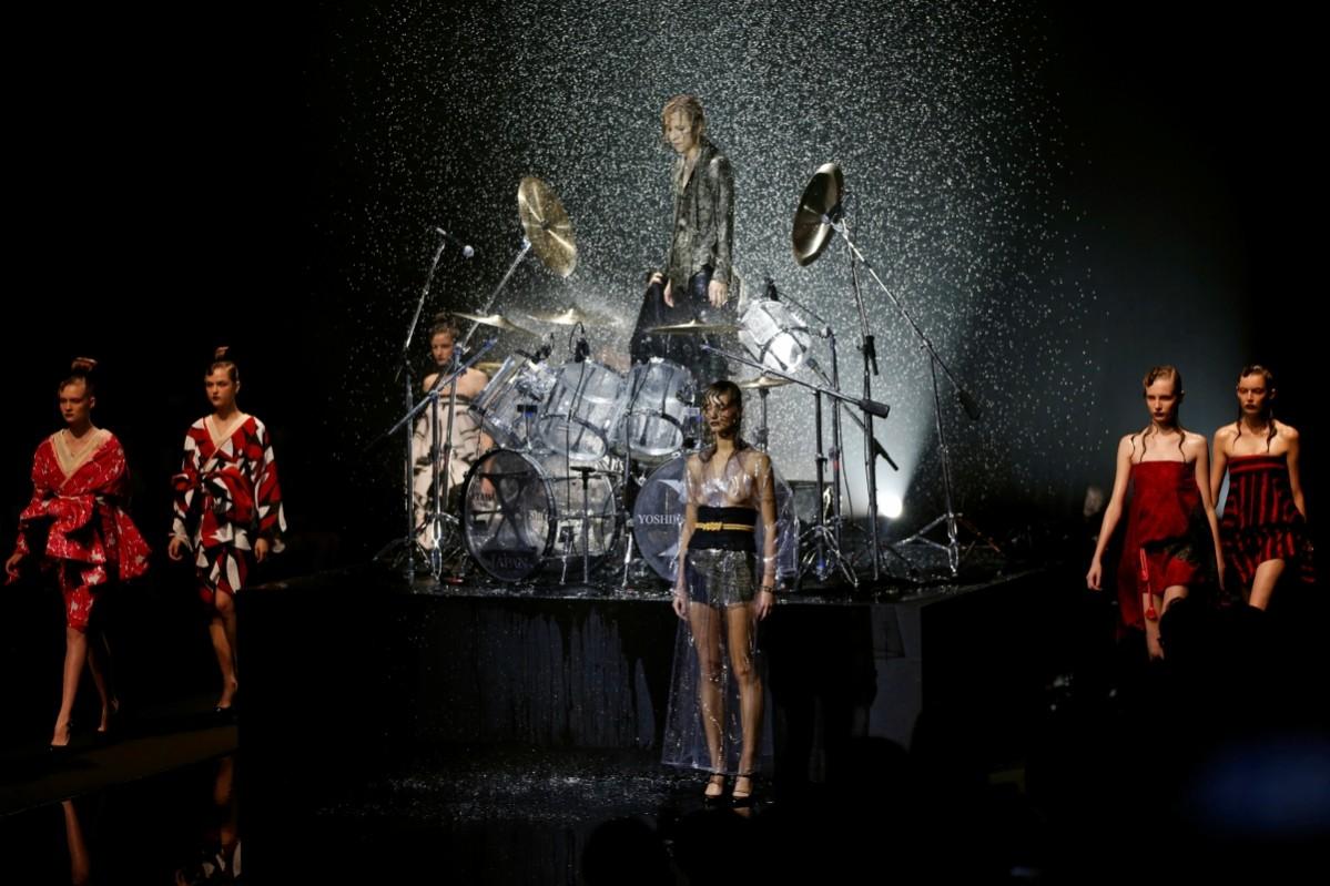 A model presents a creation by designer Yoshiki (top C), leader of Japan's band Tokyo Fashion Week