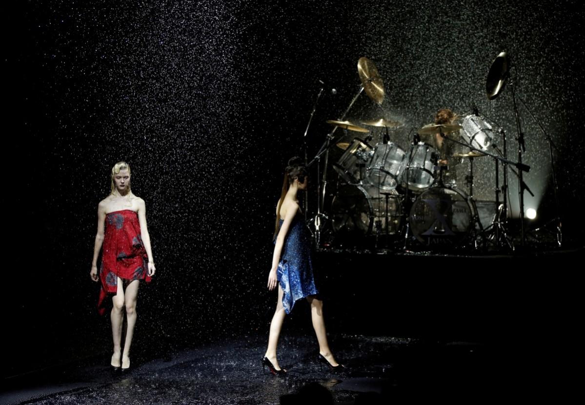 Models present creations by designer Yoshiki (R), leader of Japan's rock band Tokyo Fashion Week