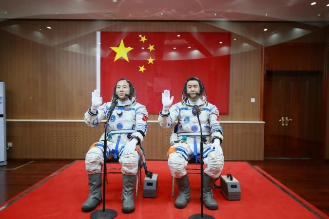 Chinese astronauts Jing Haipeng (L) and Chen Dong