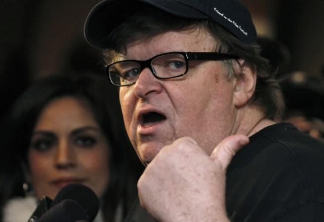 Documentary filmmaker Michael Moore gestures while being interviewed at Michael Moore