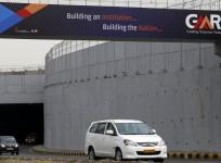 gmr stake sale airport delhi energy water roads projects share price debt leverage service bank loans india turkey maldives controversy bjp congress