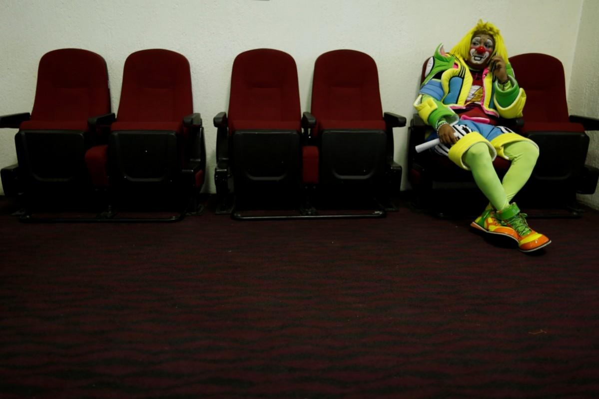 A clown rests during the XXI Convention of Clowns, at the Jimenez Rueda Theatre, in Mexico City, Mexico, October 19, 2016. Convention of Clowns