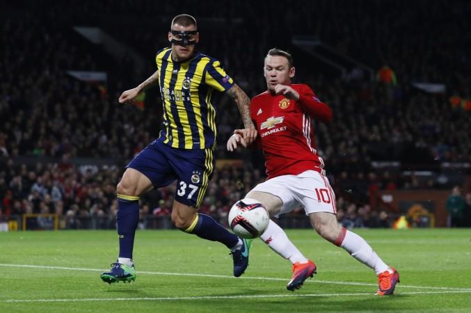 Wayne Rooney during a duel with Fenerbahce's Martin Skrtel during their Europa League game rooney