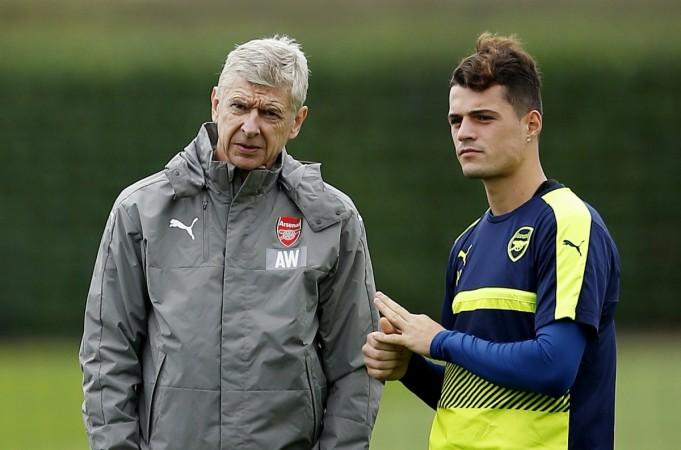 Arsenal manager Arsene Wenger with Granit Xhaka during a training session granit xhaka