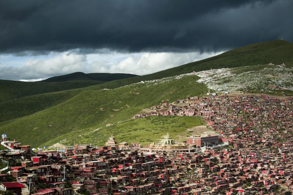 A view shows the settlements of Larung Gar Buddhist Academy in Sertar County of Garze Tibetan Autonomous Prefecture, Sichuan province, China. The academy, founded in the 1980s among the mountains of the remote prefecture, is one of the largest Tibetan Buddhism institutes of the world, housing tens of thousands of monks and nuns, according to local media. Picture taken July 23, 2015. Larung Gar Buddhist Academy