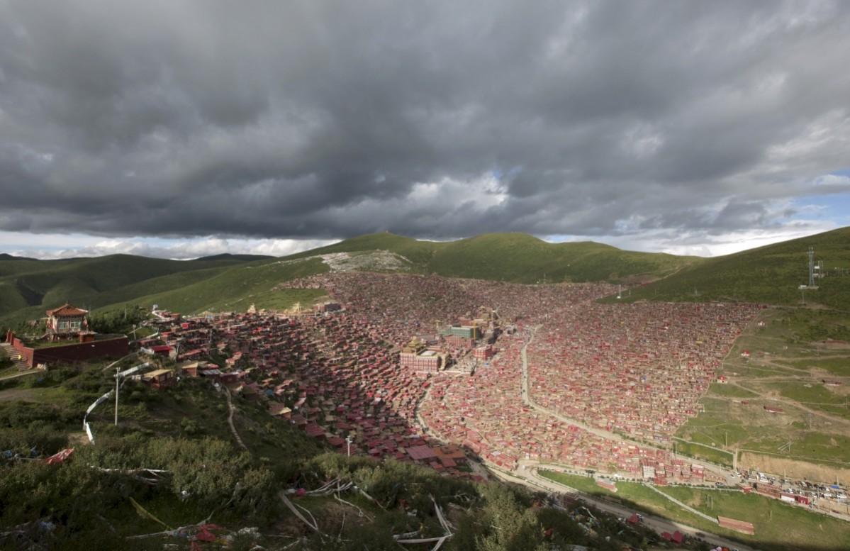 A general view shows the settlements of Larung Gar Buddhist Academy in Sertar County of Garze Tibetan Autonomous Prefecture, Sichuan province, China. The academy, founded in the 1980s among the mountains of the remote prefecture, is one of the largest Tibetan Buddhism institutes of the world, housing tens of thousands of monks and nuns, according to local media. Picture taken July 23, 2015. Larung Gar Buddhist Academy