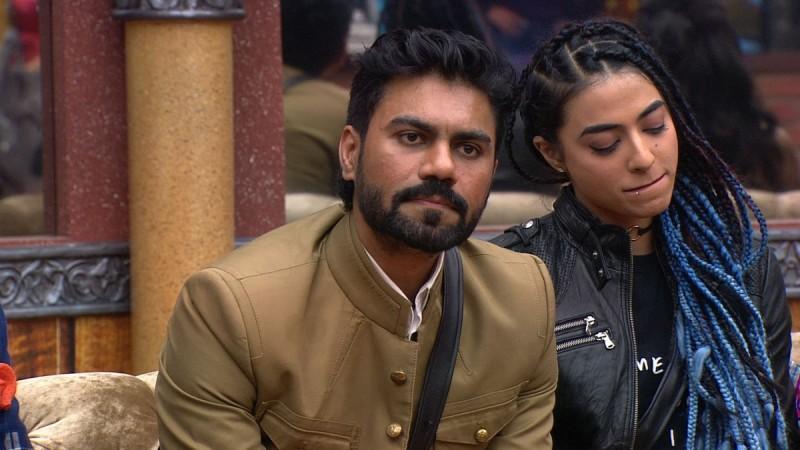 Gaurav Chopra with VJ Bani sitting in the living area of Bigg Boss 10 house Bigg Boss 10