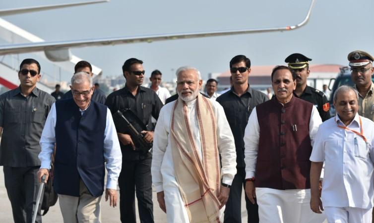 In picture: Prime Minister Narendra Modi arrives at Vadodara, Gujarat, on October 22, 2016. Gujarat and Madhya Pradesh Governor OP Kohli and Gujarat Chief Minister Vijay Rupani are also seen. Narendra Modi