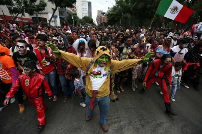 People dressed as zombies participate in a Zombie Walk procession in Mexico City, Mexico, October 22, 2016. Zombie Walk procession