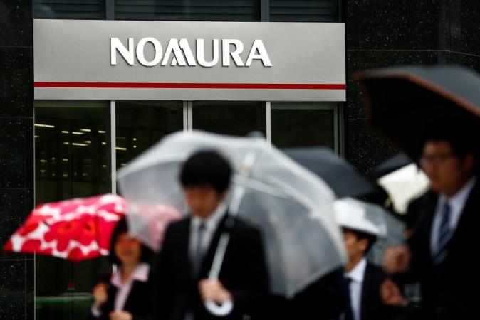 People walk past a branch of the Nomura financial services group in Tokyo, Japan, April 28, 2016 (representational image). nomura bdo bank Philippine Stock Exchange online trading southeast asia india financial services banking services customer accounts brokerage