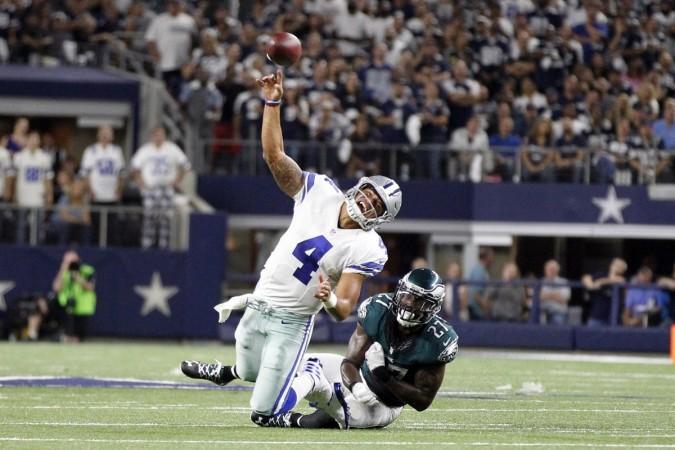Dallas Cowboys quarterback Dak Prescott (4) is hit as he throws a pass by Philadelphia Eagles strong safety Malcolm Jenkins (27) in the fourth quarter at AT&T Stadium. Dak Prescott