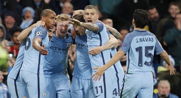 Manchester City players celebrate after scoring a goal against Barcelona in the Uefa Champions League, November 1, 2016 Manchester City