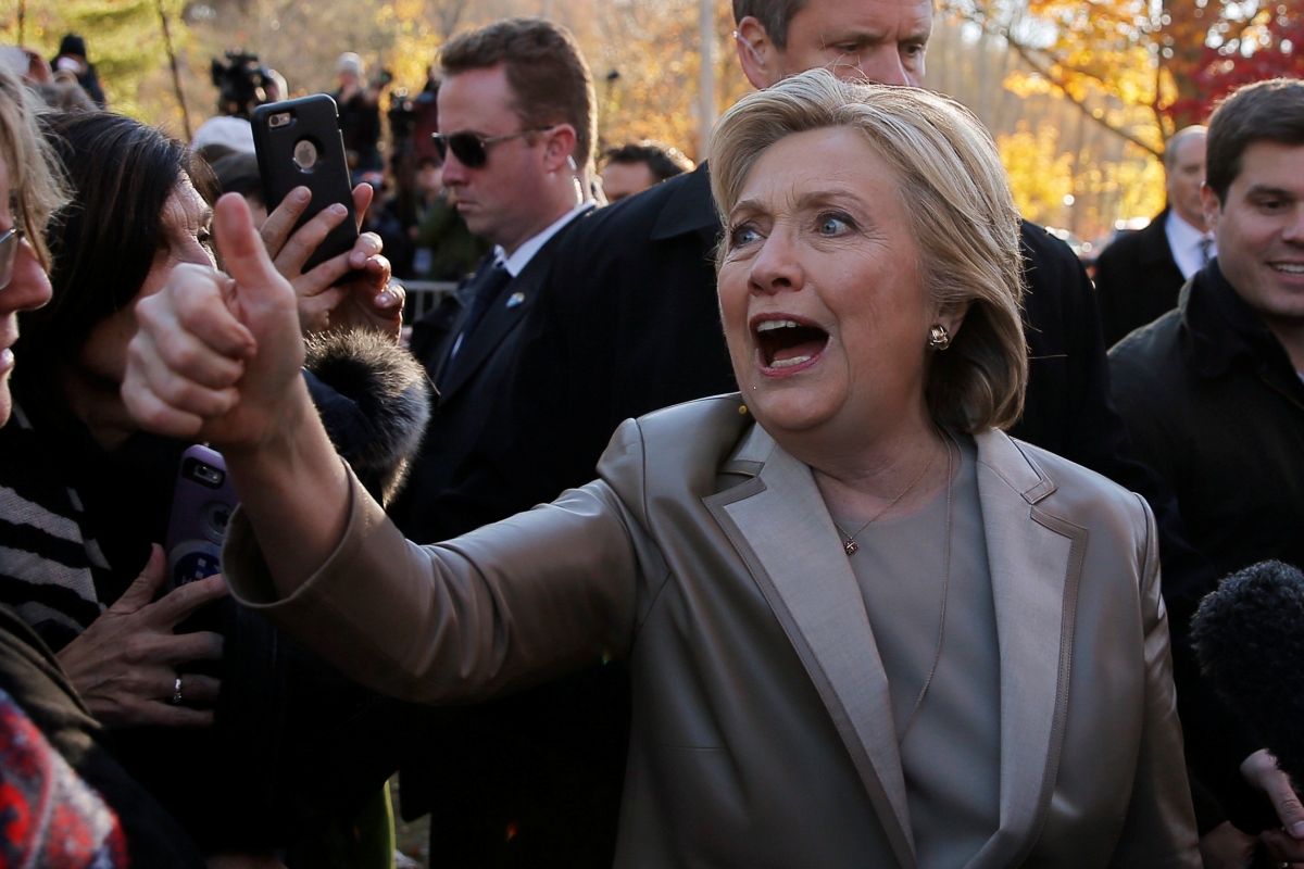 Hillary Clinton in her customary pant suit. hillary clinton fashion