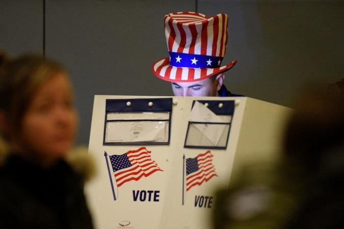 Travis Lopes, 30, casts his vote for the U.S. presidential election in the Manhattan borough of New York, USA November 8, 2016. US presidential elections voting
