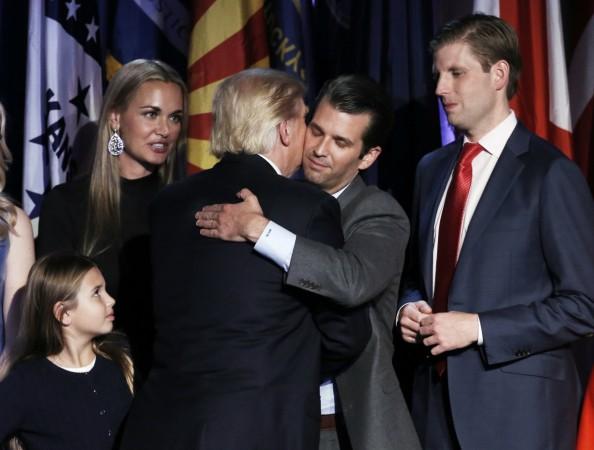 U.S. President-elect Donald Trump embraces his son Donald Trump Jr. during his election night rally in Manhattan, New York, U.S., November 9, 2016. Donald Trump