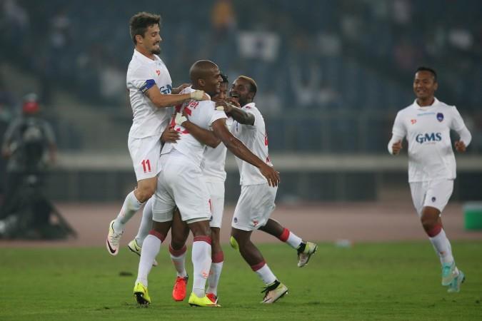 Florent Malouda is congratulated by his Delhi Dynamos teammates after the Frenchman scored a brace in the match delhi dynamos