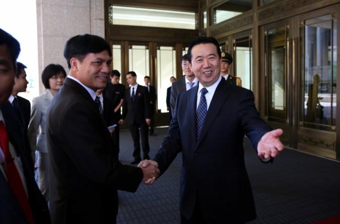 Meng Hongwei (R), Chinese Vice Public Security Minister, shakes hands with Nguyen Quang Dam, the commandant of the Vietnam Coast Guard, in Beijing, China, August 26, 2016. Picture taken August 26, 2016. Meng Hongwei