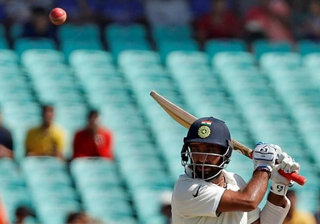 India No.3 Cheteshwar Pujara plays a shot through the offside on day three of the first Test match against England, November 11, 2016 Cheteshwar Pujara India