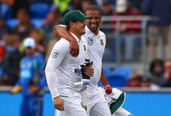 South Africa's wicketkeeper Quinton de Kock laughs with team mate Vernon Philander after they dismissed Australia in Hobart australia vs south africa
