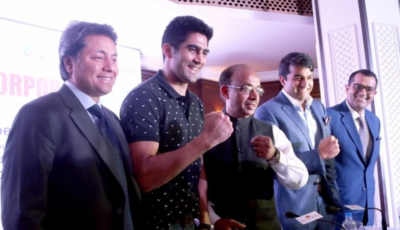Vijender Singh with sports minister Vijay Goel during an event in India vijender