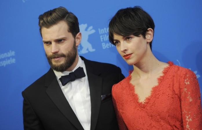 Actor Jamie Dornan and his wife Amelia Warner (R) arrive for the screening of the movie 'Fifty Shades of Grey' at the 65th Berlinale International Film Festival in Berlin February 11, 2015. Jamie Dornan