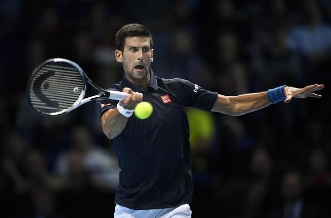 Novak Djokovic plays a forehand during his win over Milos Raonic, November 15, 2016 Novak Djokovic