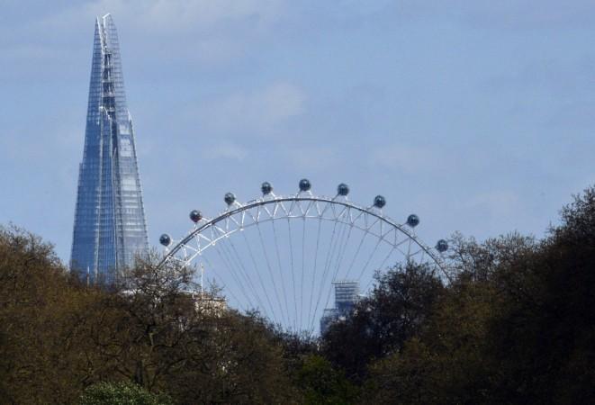 The Shard skyscraper is seen behind the London Eye in central London. Shard, London