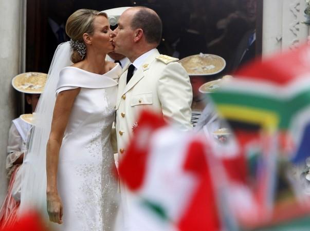 Princess Charlene (L) and Monaco's Prince Albert II kiss outside the Saint Devote church in Monaco after their religious wedding ceremony in Monaco July 2, 2011. Princess Charlene dropped off her bridal bouquet at the church, named after the patron saint of Monaco, following their wedding at the Palace. Charlene Wittstock and Prince Albert II of Monaco