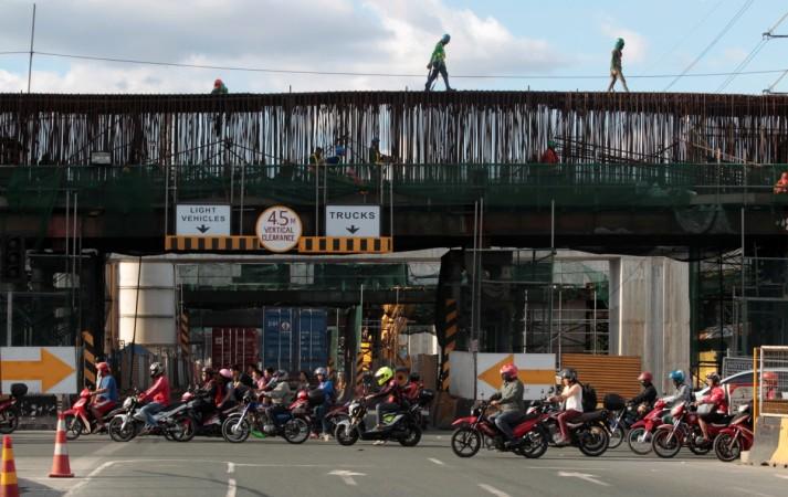 Labourers work at a construction site of a new expressway in Manila, Philippines Philippines construction
