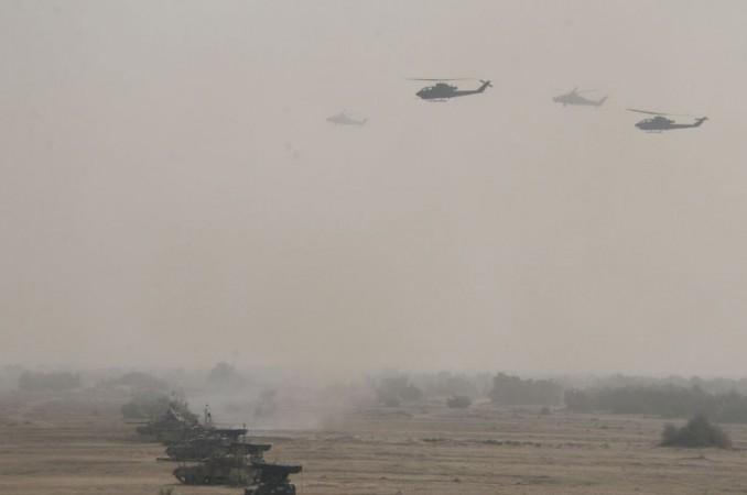 Pakistani armoured divisions conduct drills with close-air support from attack choppers. Pakistani military drills near India border