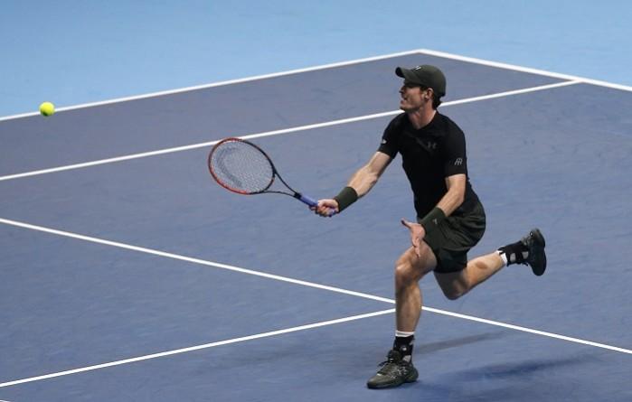 Andy Murray plays a forehand volley during his win over Stan Wawrinka at the ATP World Tour Finals Andy Murray