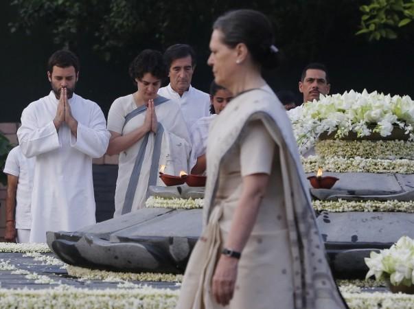 Chief of India's Congress party Sonia Gandhi (foreground), her daughter Priyanka Vadera (2nd ,son-in-law Robert Vadera (R) and son Rahul Gandhi (L) pay tribute at the memorial of former prime minister Rajiv Gandhi on the occasion of the former prime minister's 69th birth anniversary, in New Delhi August 20, 2013. Rajiv Gandhi