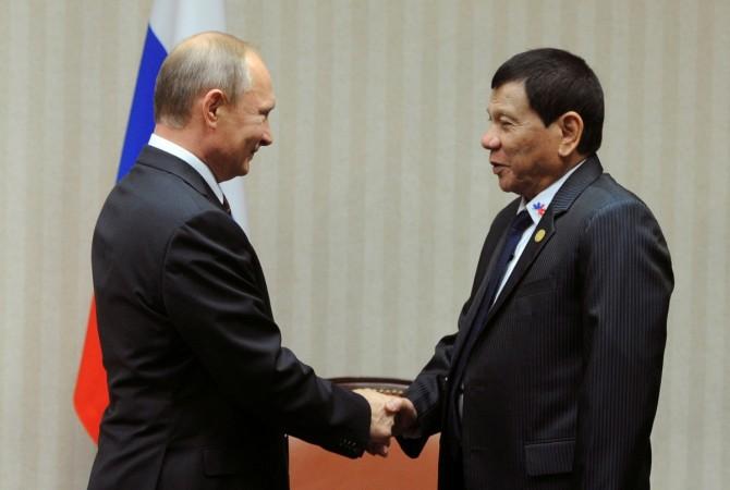 Russian President Vladimir Putin and Philippine President Rodrigo Duterte attend a meeting on the sidelines of the Asia-Pacific Economic Cooperation (APEC) Summit in Lima, Peru Duterte and Putin
