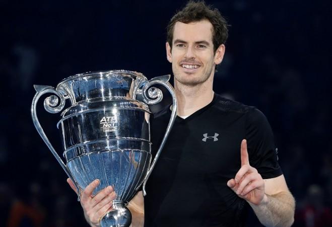 Andy Murray poses with the ATP Word Tour Finals trophy after defeating Novak Djokovic in the final, November 20, 2016 Andy Murray