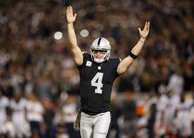 Oakland Raiders quarterback Derek Carr celebrates a touchdown in the NFL game against the Denver Broncos, November 6, 2016 Oakland Raiders Derek Carr