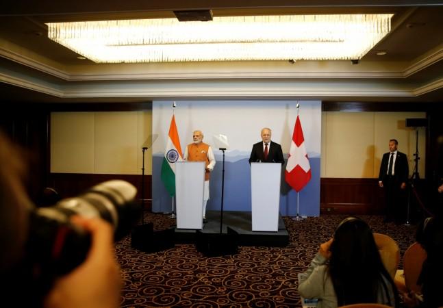 india switzerland black money agreement tax haven aeoi adhia black money surgical strike demonetisation deal tax evasion stashed in