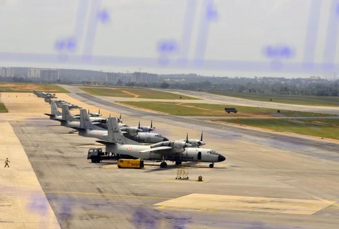 Parked Indian Air Force's transport aircrafts Antonov An-32 (foreground) and Dornier Do 228 are seen from the air traffic control during a media tour at the Yelahanka Air Force Station. Dornier Aircraft
