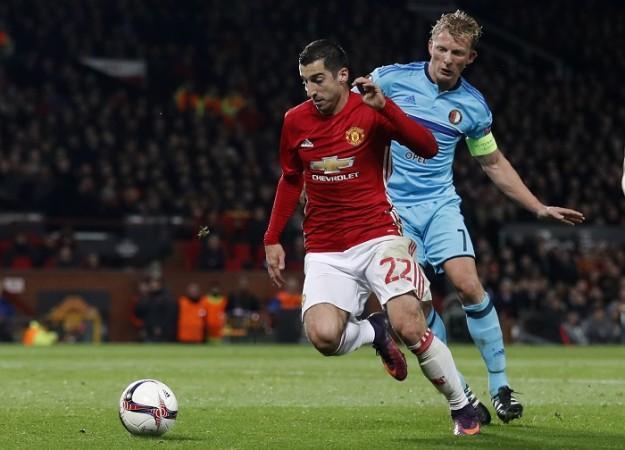 Manchester United playmaker Henrikh Mkhitaryan runs away from Feyenoord player Dirk Kuyt in their Europa League match, November 24, 2016 Henrikh Mkhitaryan Manchester United Dirk Kuyt Feyenoord