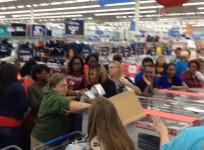 Rowdy Walmart shoppers wrestle for DVD player ahead of Black Friday