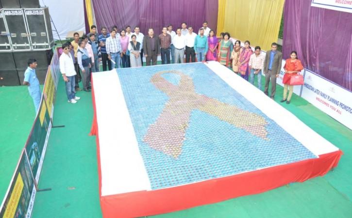 The largest condom mosaic measures 18.51 m² (199.24ft²) and was created by UPSACS, INDEX IIM lucknow and HLFPPT (all India), in Lucknow, India, on 16 November 2014. condom
